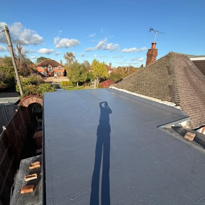 Close-up of neatly installed roof shingles.